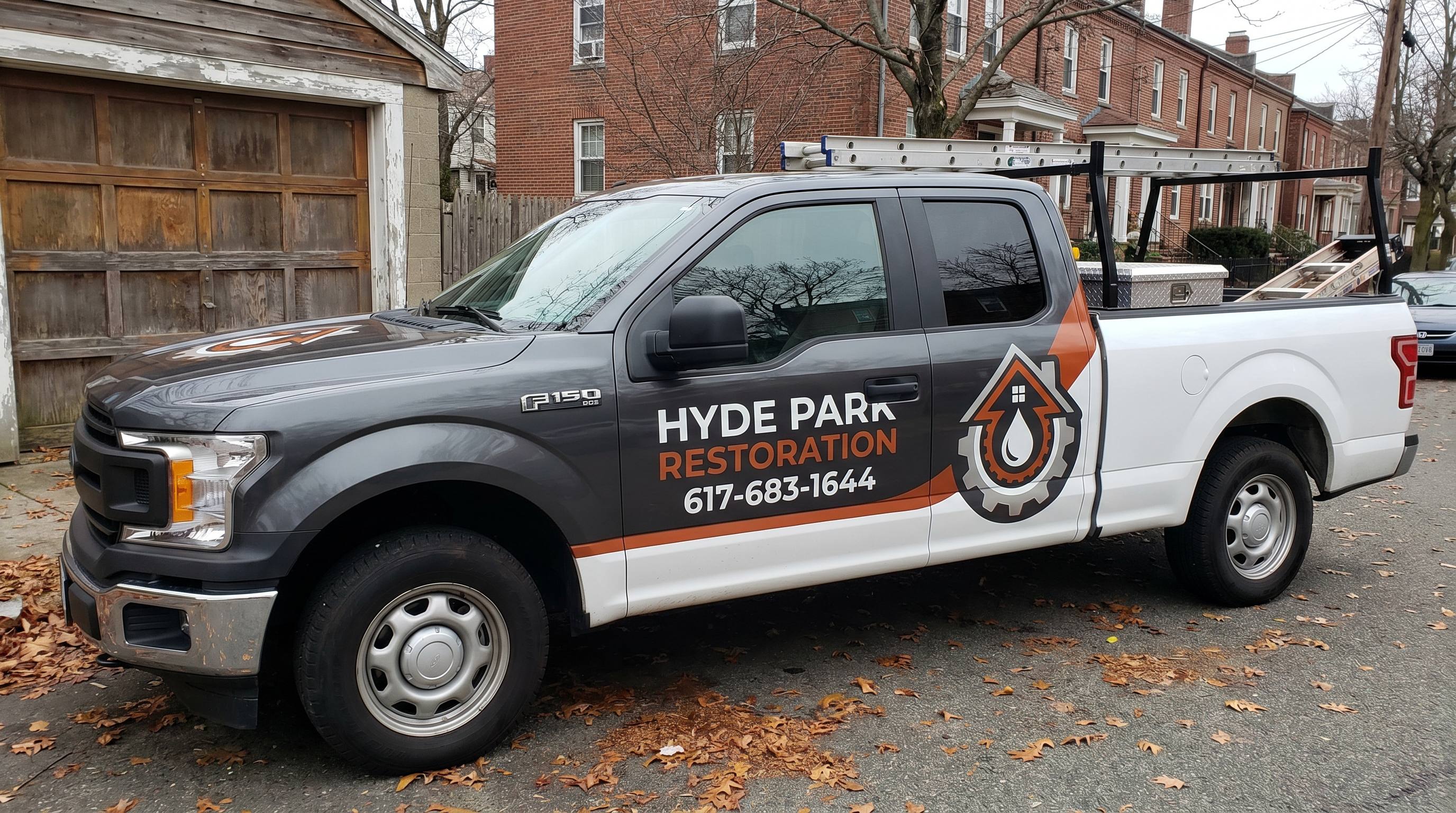 Hyde Park Restoration's branded response truck parked on a job site in Boston